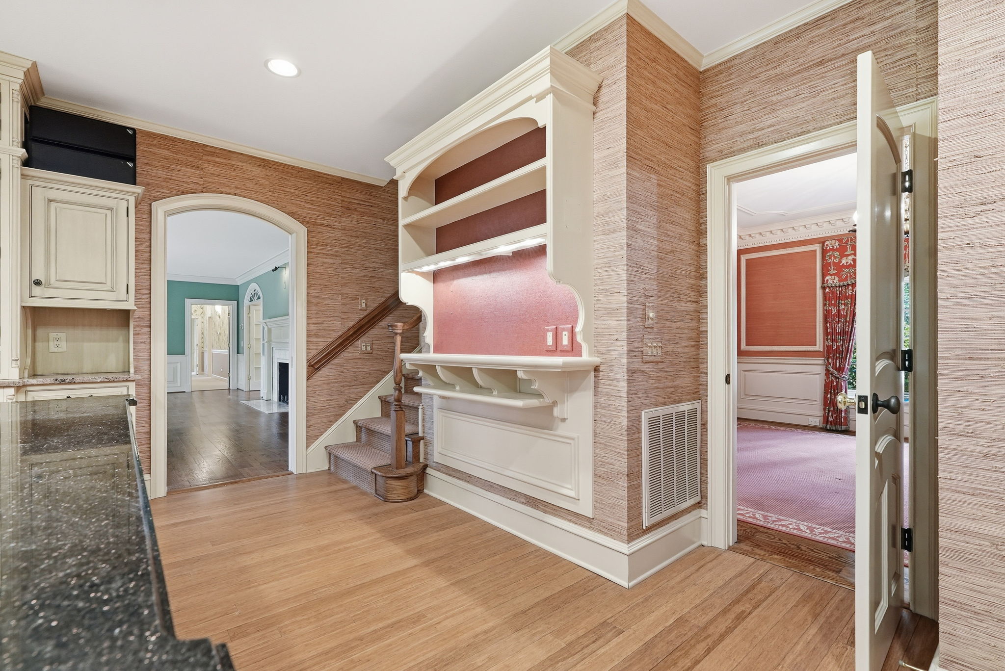 A warm hall with a turning stair