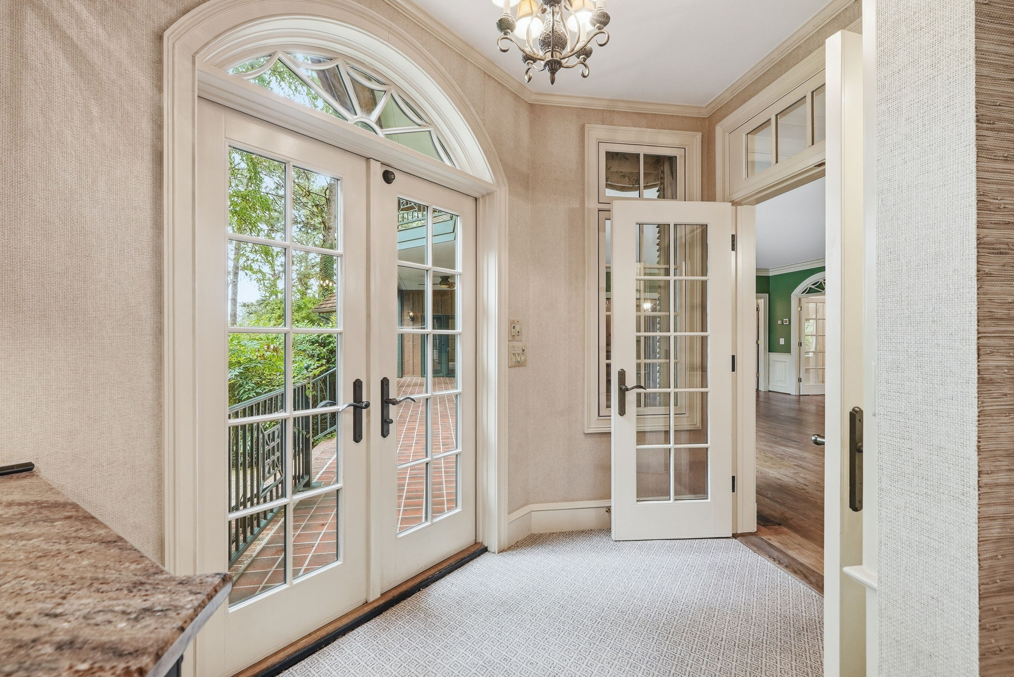 French doors under an arched fanlight